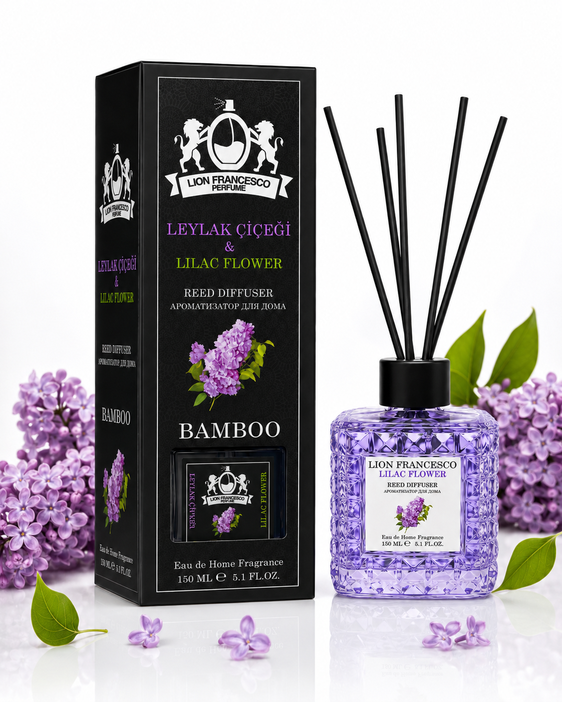 Lion Francisco Reed Diffuser in Lilac Flower and Bamboo scent, featuring a black box, a clear bottle filled with lavender beads, and bamboo reeds, styled with purple lilac flowers and green leaves on a white background.