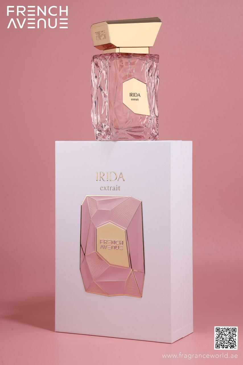 Irida Extrait by Fragrance World EDP — pink bottle standing on its white box against a pink studio background