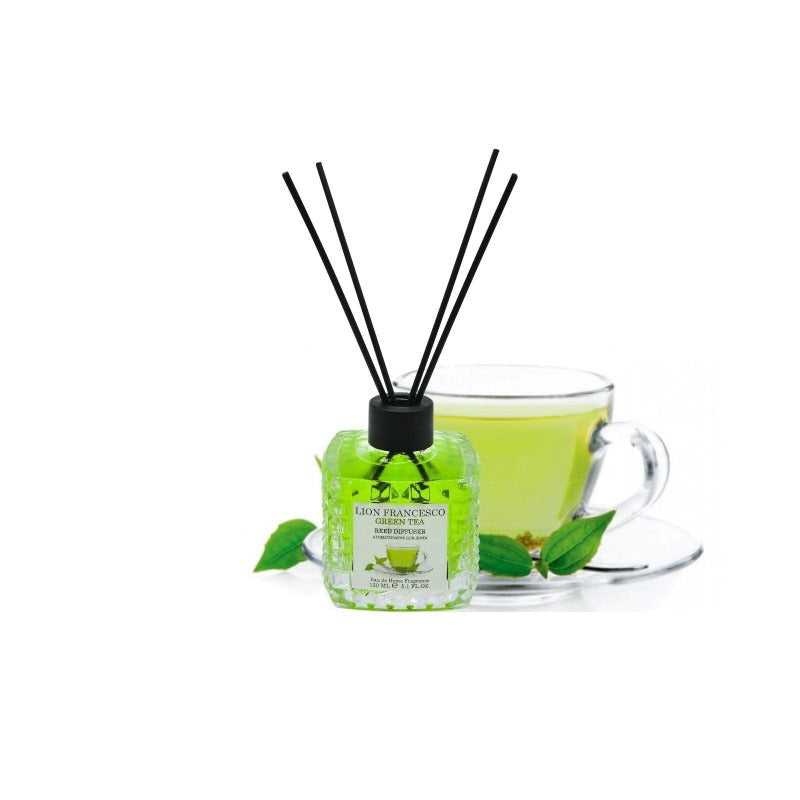 Lion Francesco Green Tea reed diffuser 150 ml bottle with rattan sticks beside a cup of green tea