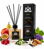 A reed diffuser bottle with black reeds and a matching black retail box, styled with fruit, flowers, vanilla beans, cinnamon, and purple blossoms on a white background. The packaging reads San Francisco Perfume, Kirke, and Bamboo.