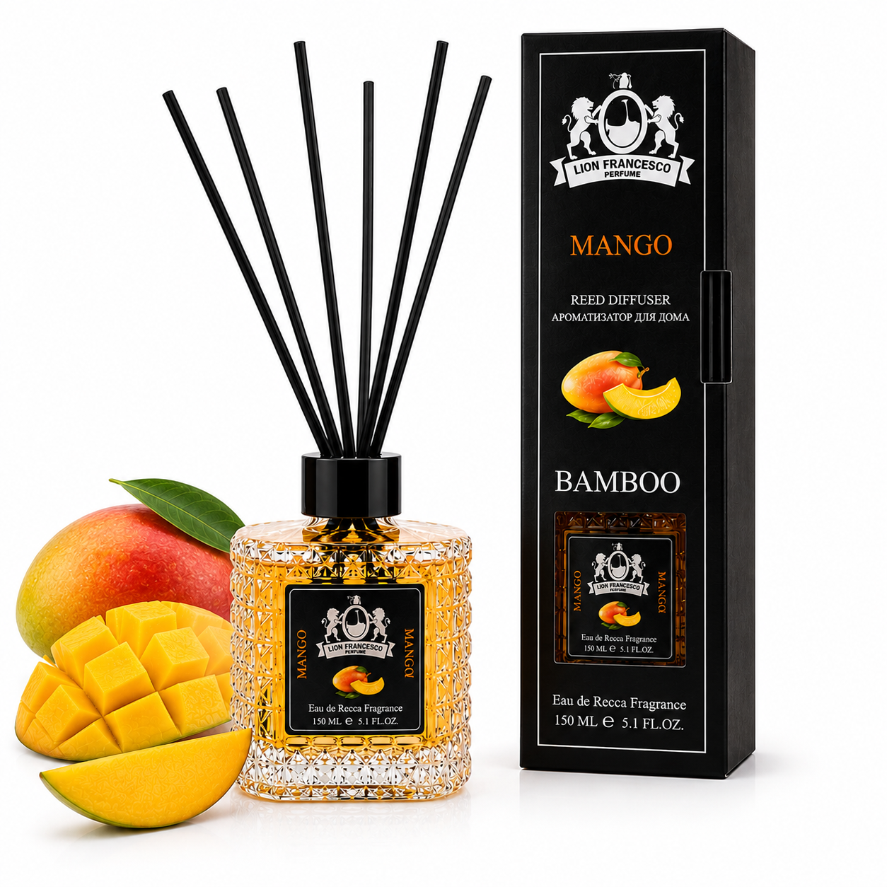 A reed diffuser bottle with black reeds and a black cap stands beside its retail box and mango props on a white background. The bottle contains a sparkling golden liquid and has a front label reading 'San Francisco Aromas' and 'Mango Bamboo.
