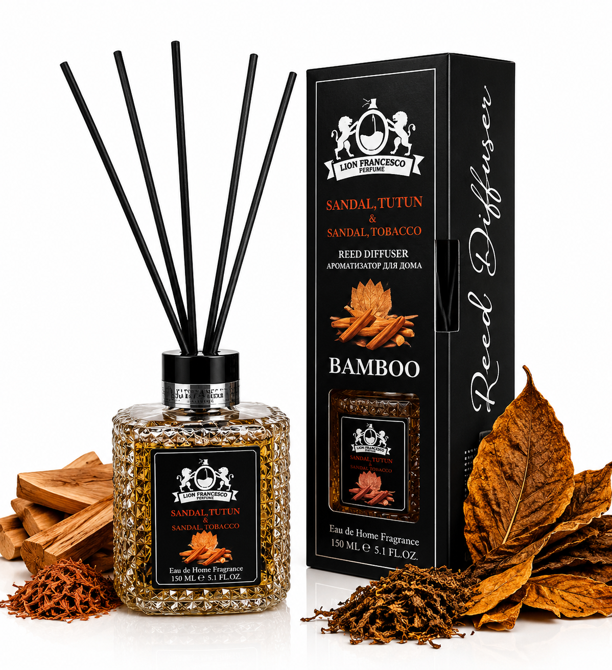 Lion Francesco Sandal & Tobacco Reed Diffuser 150 ml with black reeds, displayed beside its black packaging with sandalwood pieces and dried tobacco leaves on a white background.
