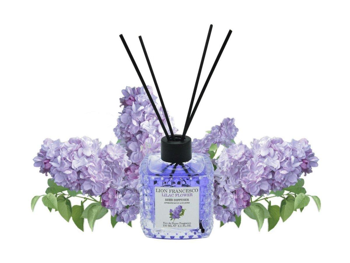 Lion Francesco Lilac Flower reed diffuser 150 ml bottle with rattan sticks surrounded by lilac blossom